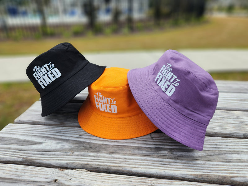 The Fight Is Fixed® Signature Bucket Hats (White Lettering)
